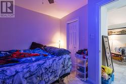 The upper unit bedroom which has a closet. -