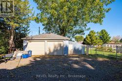 The double car garage. The floor is gravel. -