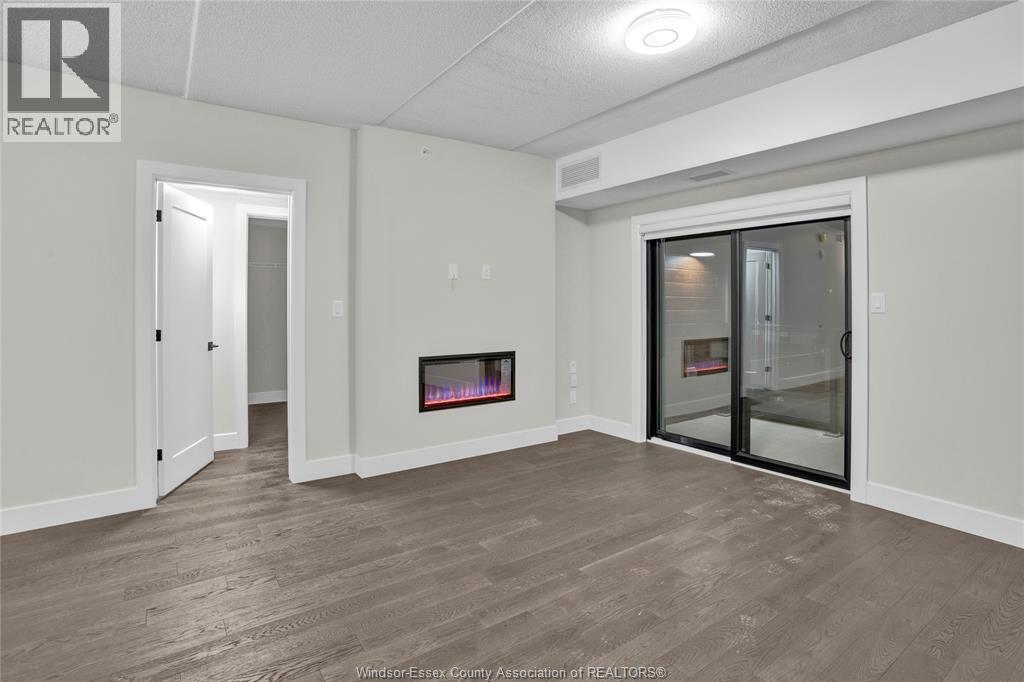 2600 Sandwich West Parkway Unit# 301, Lasalle, ON - Indoor With Fireplace