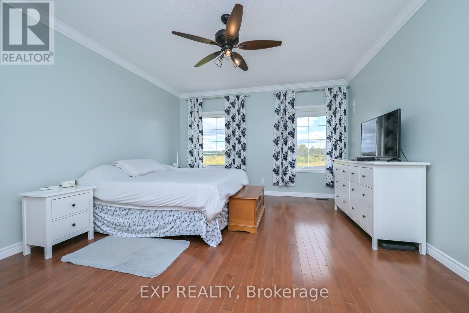 Primary Bedroom with huge walk-in closet - 434499 4Th Line, Amaranth, ON - Indoor Photo Showing Bedroom