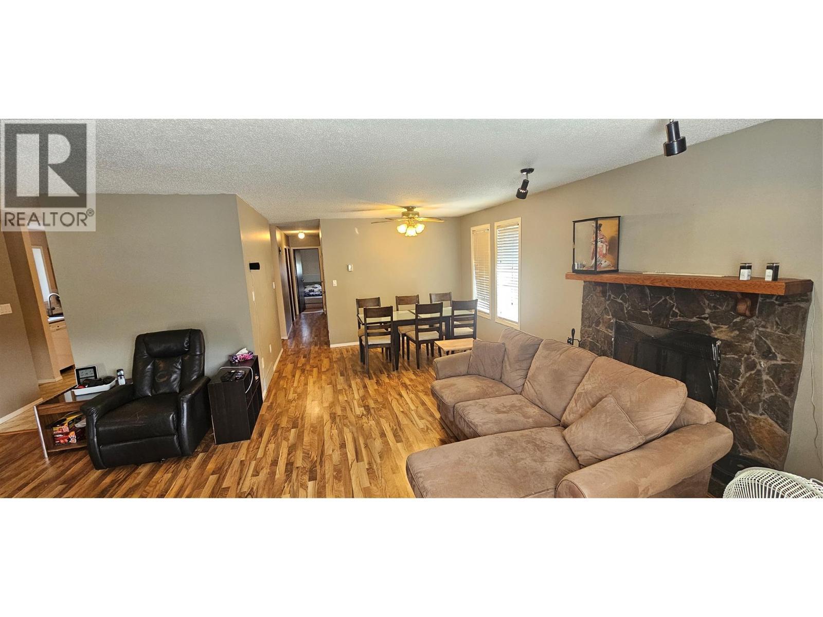 1234 Hickory Crescent, Sparwood, BC - Indoor Photo Showing Living Room With Fireplace