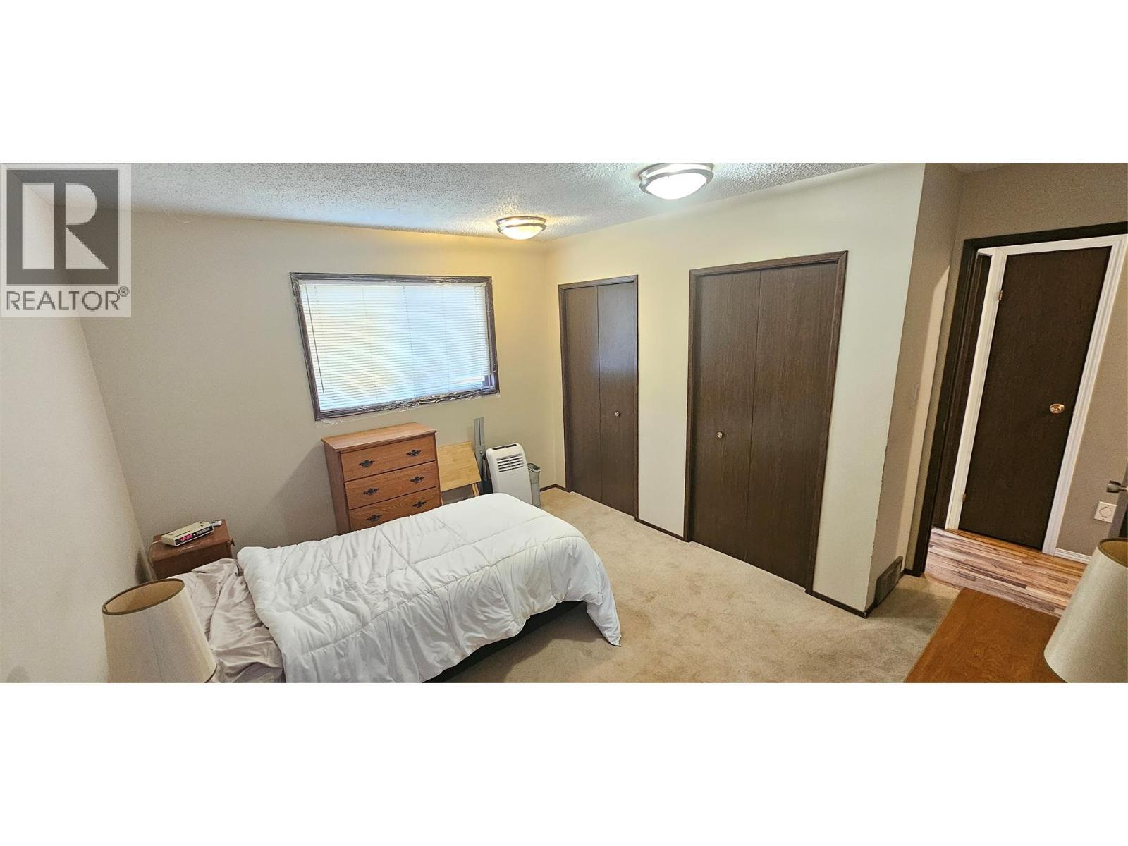 Primary bedroom - 1234 Hickory Crescent, Sparwood, BC - Indoor Photo Showing Bedroom