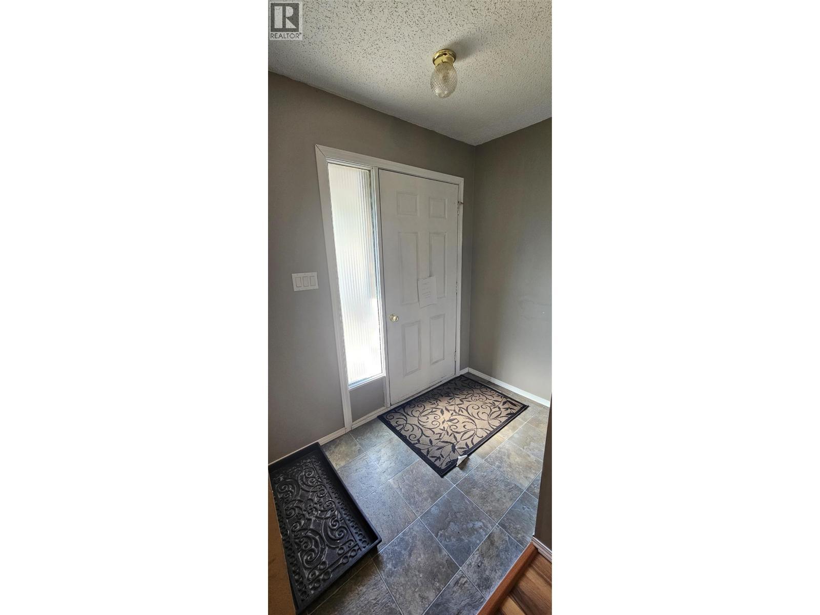 The front door and entranceway - 1234 Hickory Crescent, Sparwood, BC - Indoor Photo Showing Other Room