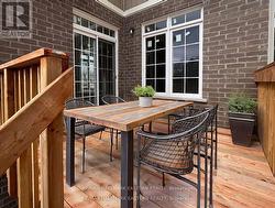 Rear deck with virtually staged furniture -
