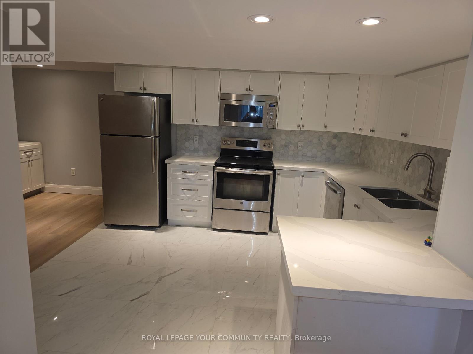 Lower Level - 312 Cochrane Street, Whitby, ON - Indoor Photo Showing Kitchen With Double Sink