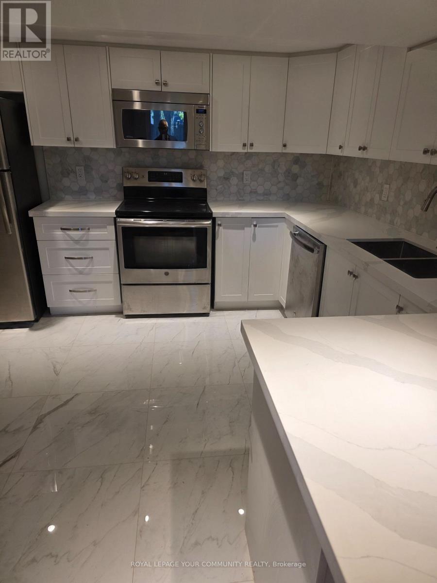 Lower Level - 312 Cochrane Street, Whitby, ON - Indoor Photo Showing Kitchen With Double Sink