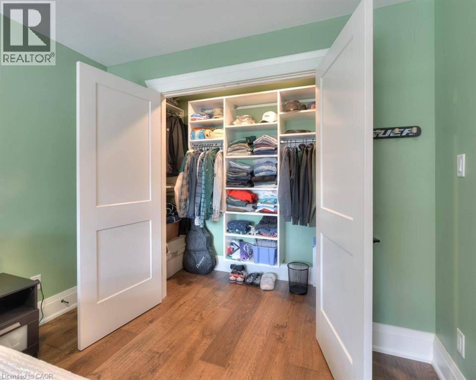 Walk-in closet with built in organizers - 12 George Street, Waterloo, ON - Indoor
