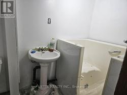BASEMENT BATHROOM W. BATHTUB (NOT CONNECTED) -