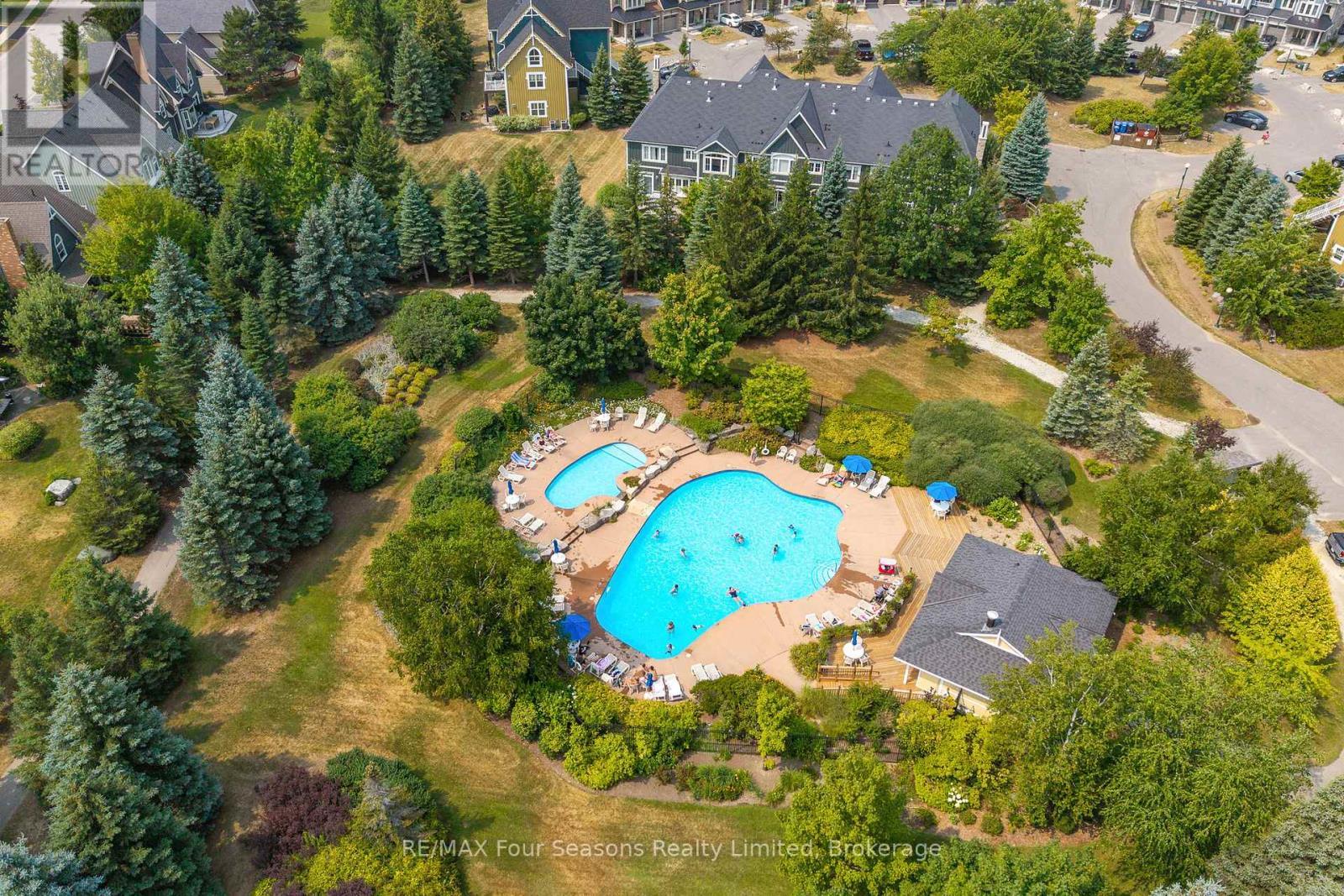 114 - 184 Snowbridge Way, Blue Mountains, ON - Outdoor With In Ground Pool With View