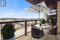 ample sized 2nd floor balcony with glass rails -