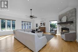 Living room with fireplace and walkout to pool -