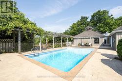 Pool house with concrete surround -