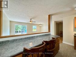 Breakfast counter area looking into living room. -