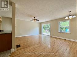 Living room area with walk out to raised decking. -