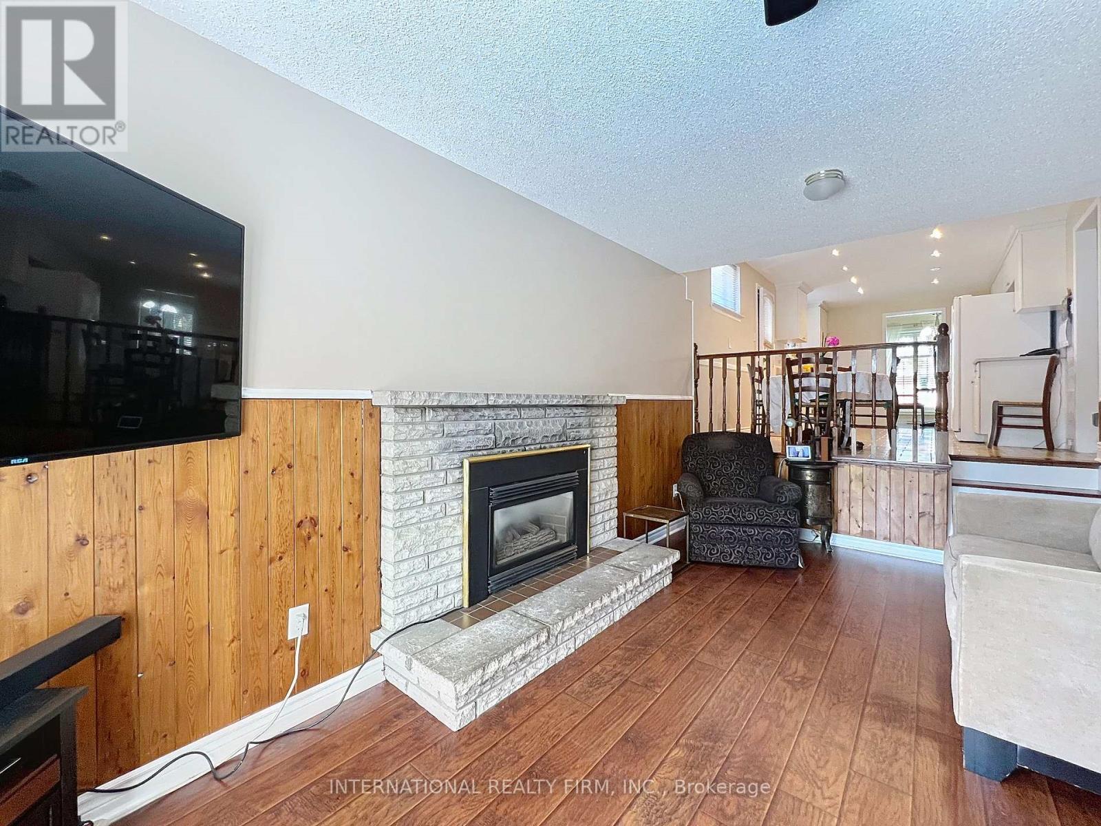Electric Fireplace - 3602 Dunrankin Drive, Mississauga, ON - Indoor Photo Showing Living Room With Fireplace