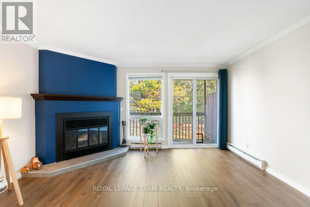 B - 6754 Jeanne D'Arc Boulevard N, Ottawa, ON - Indoor Photo Showing Living Room With Fireplace