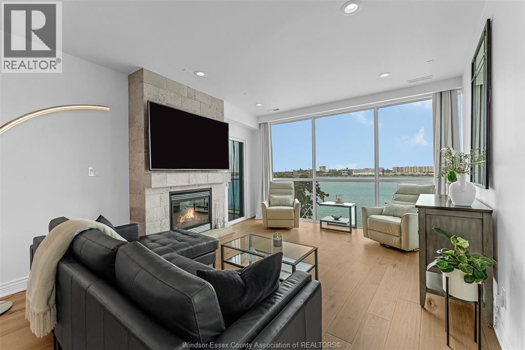 1225 Riverside Drive Unit# 404, Windsor, ON - Indoor Photo Showing Living Room With Fireplace