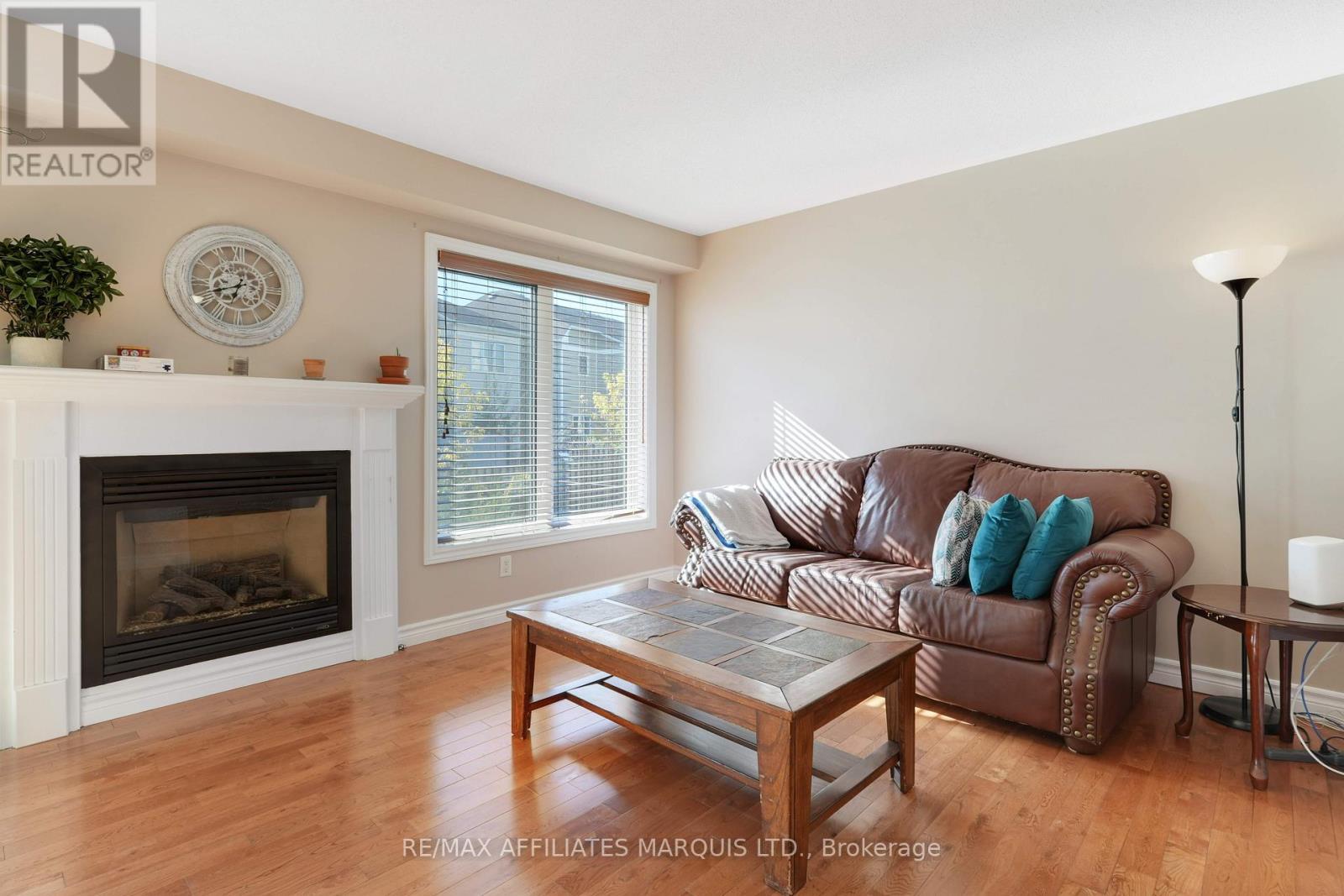Living room with fireplace - 76 Indigo Street, Ottawa, ON - Indoor Photo Showing Living Room With Fireplace