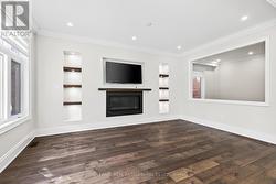 Family Rm w/gas fireplace & custom built-ins -