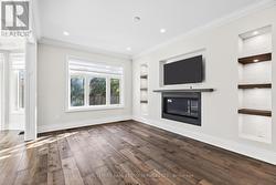 Elegant hardwood floors, pot lights, crown molding -