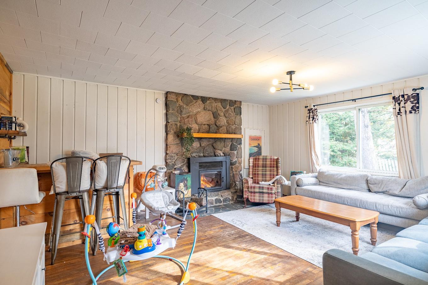 Aerial photo - 194 Ch. Du Ruisseau, Lac-Supérieur, QC - Indoor Photo Showing Living Room With Fireplace
