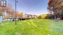 side yard with view of wrap around deck -