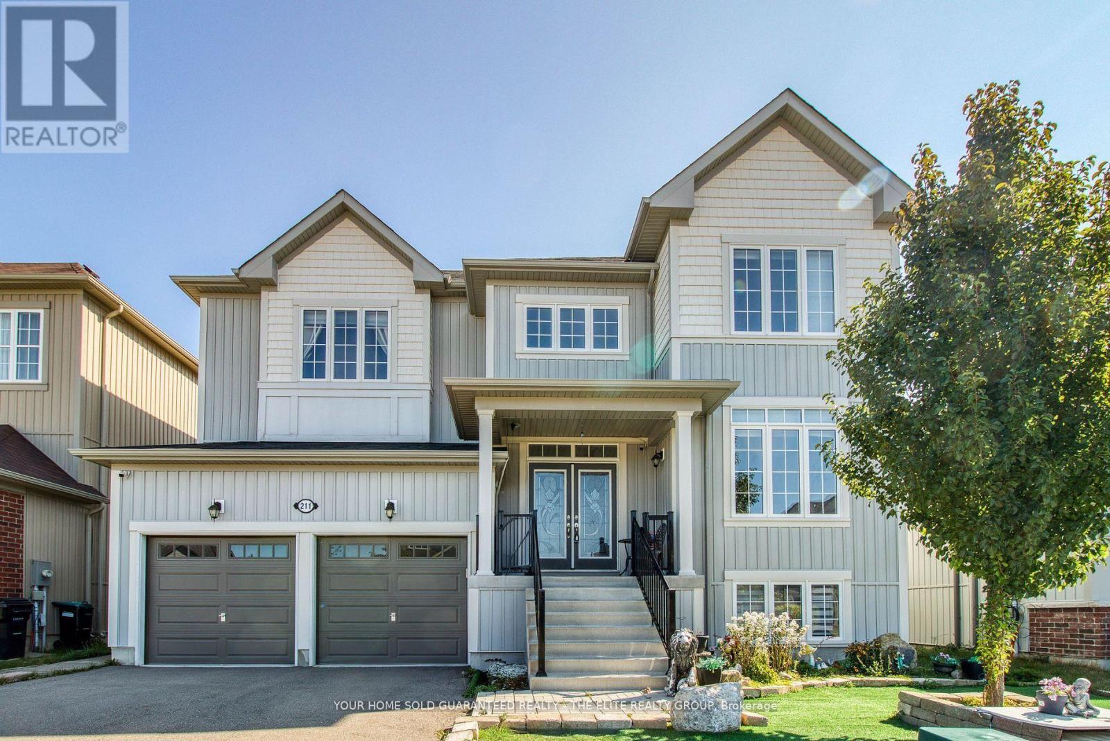 211 Lia Drive, Clearview, ON - Outdoor With Facade