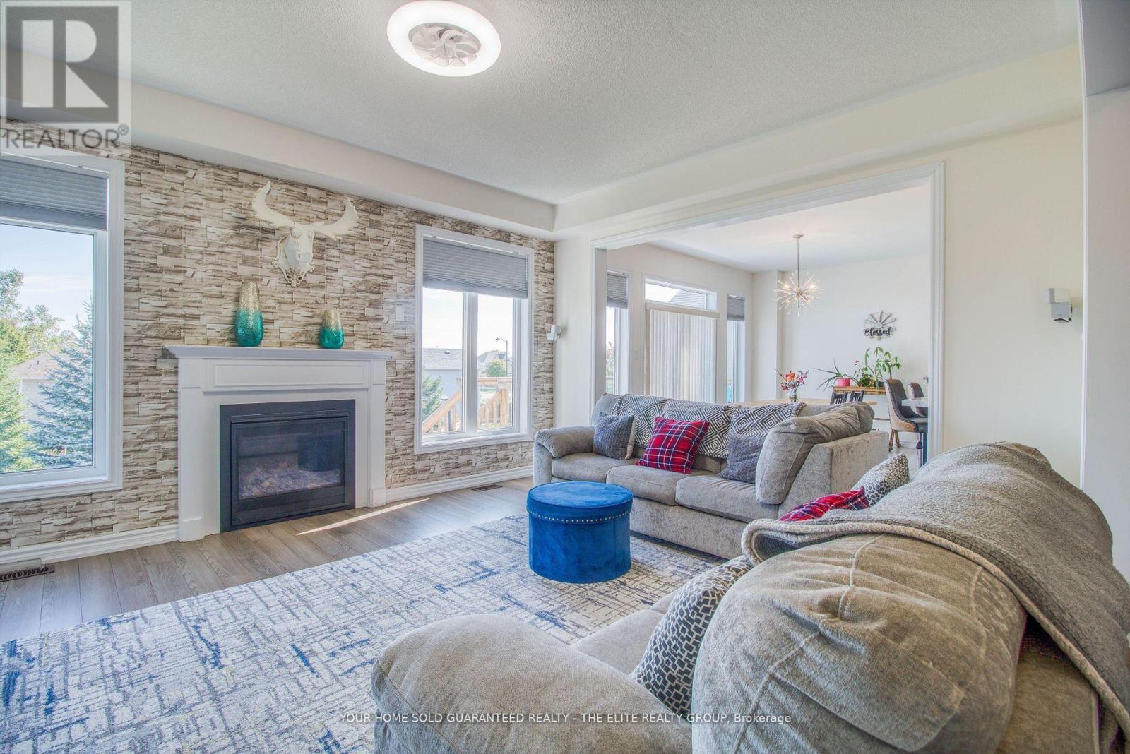 211 Lia Drive, Clearview, ON - Indoor Photo Showing Living Room With Fireplace