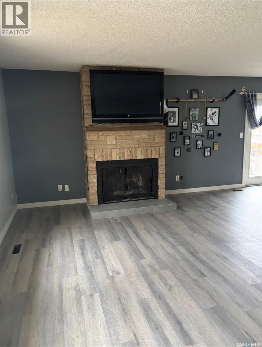 511 6Th Avenue, Cudworth, SK - Indoor Photo Showing Living Room With Fireplace