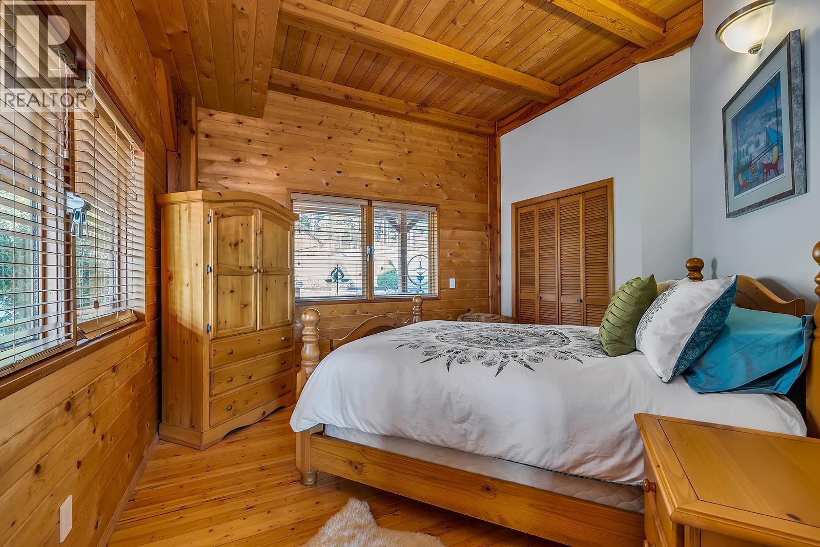 Main Floor Bedroom - 5705 Upper Booth N Road, Kelowna, BC - Indoor Photo Showing Bedroom