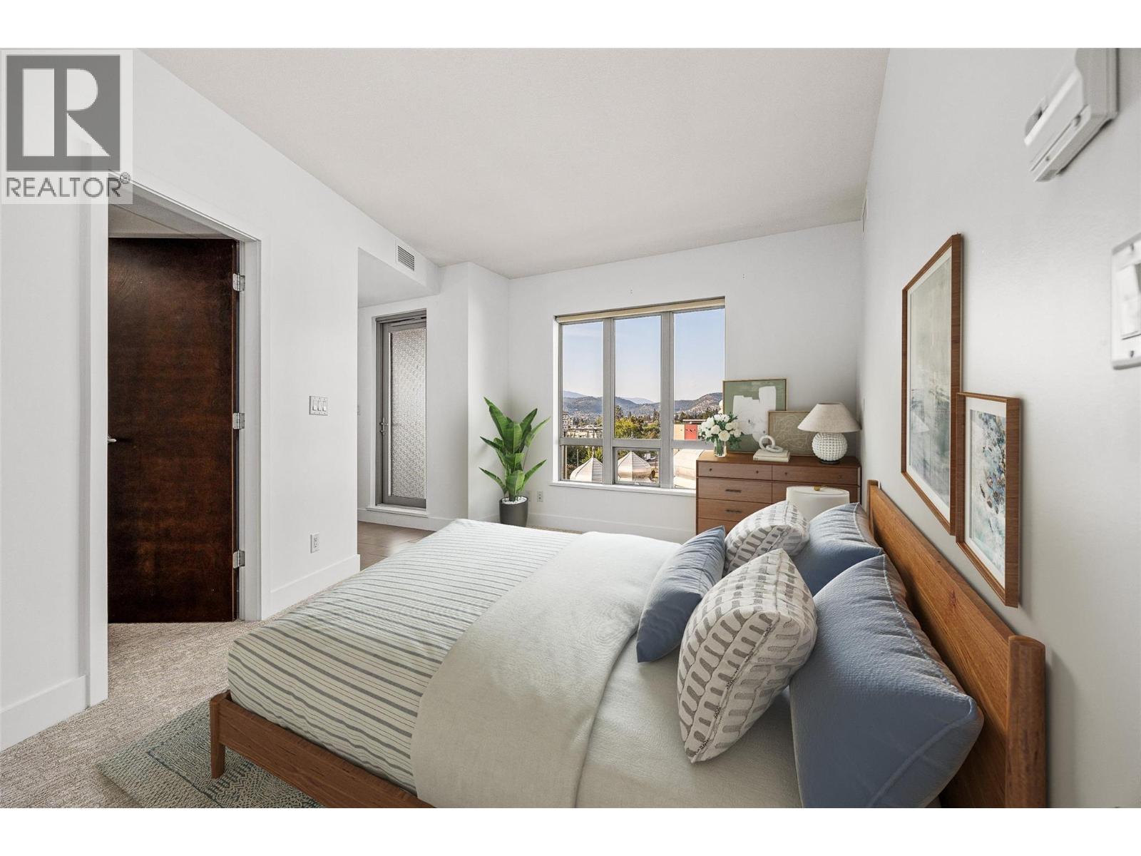 primary bedroom (virtually staged) - 2040 Springfield Road Unit# 401, Kelowna, BC - Indoor Photo Showing Bedroom