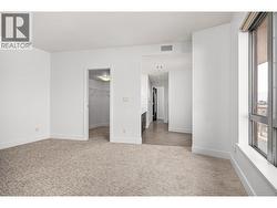 primary bedroom with walk in closet and en-suite -