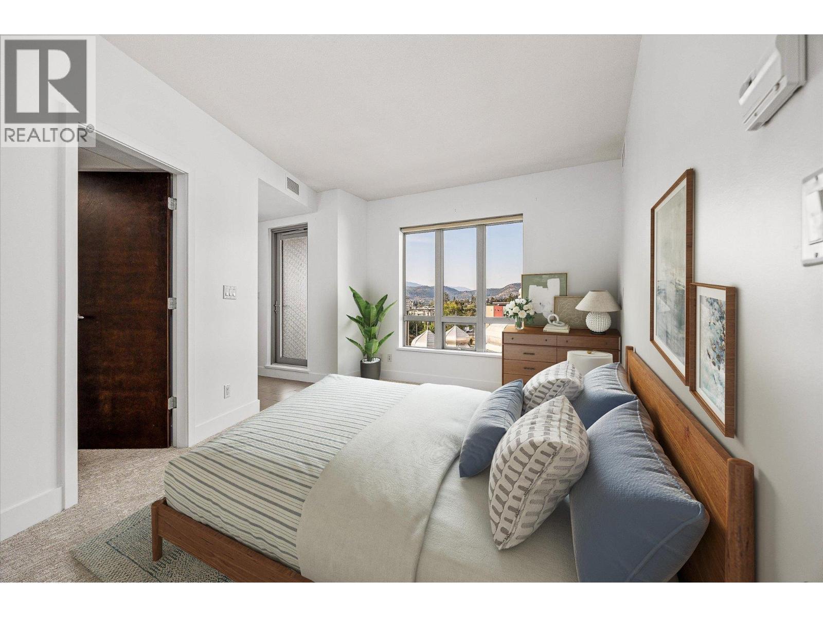 primary bedroom (virtually staged) - 2040 Springfield Road Unit# 401, Kelowna, BC - Indoor Photo Showing Bedroom