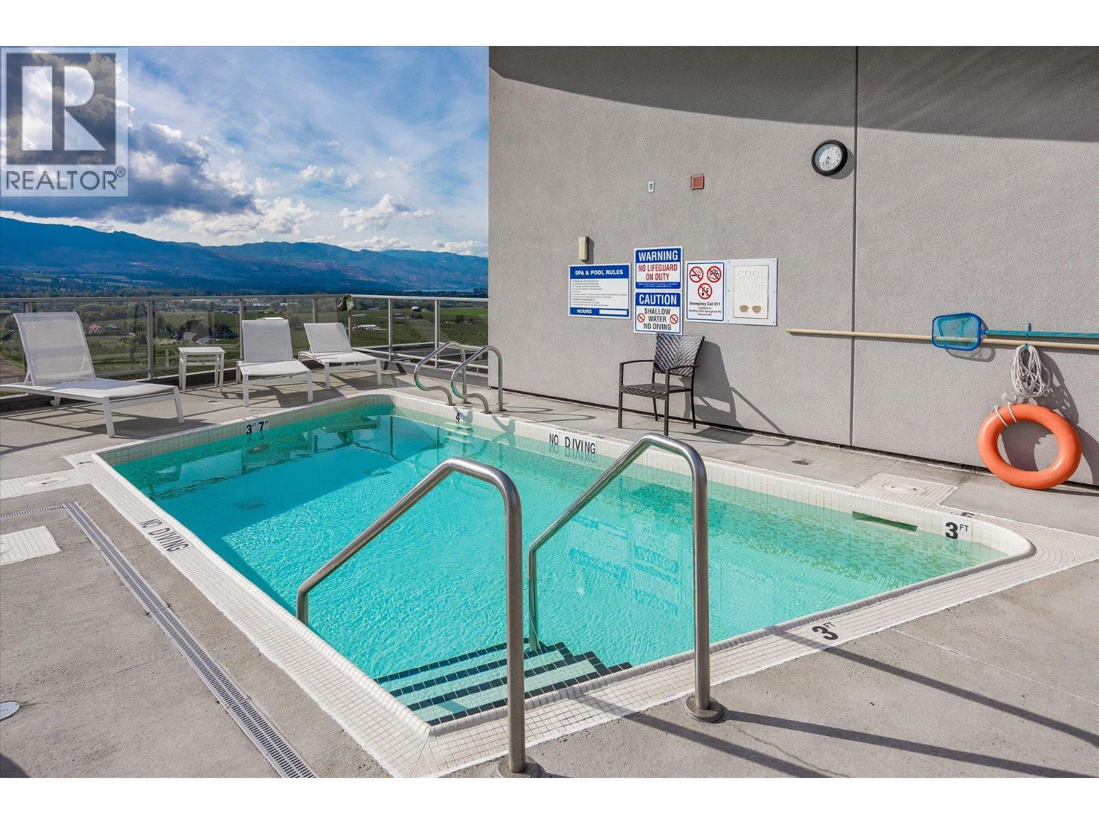 2040 Springfield Road Unit# 401, Kelowna, BC - Photo Showing Other Room With In Ground Pool