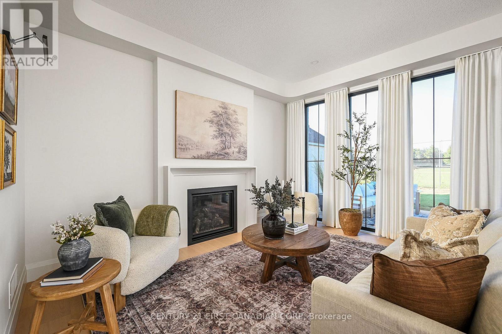 203 Foxborough Place, Thames Centre (Thorndale), ON - Indoor Photo Showing Living Room With Fireplace