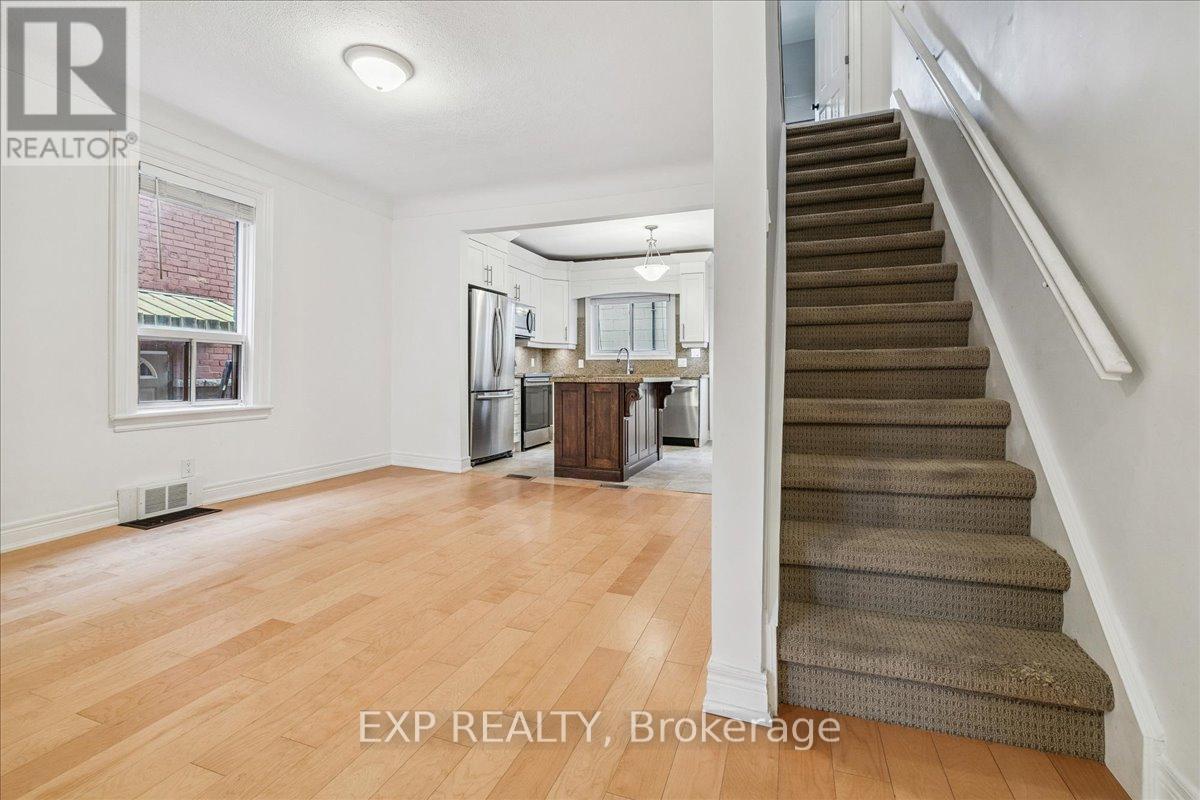 Living + Stairs + Kitchen - 29 Case Street, Hamilton, ON - Indoor Photo Showing Other Room