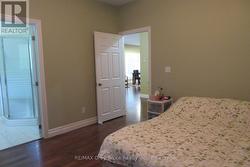 Primary bedroom facing door -