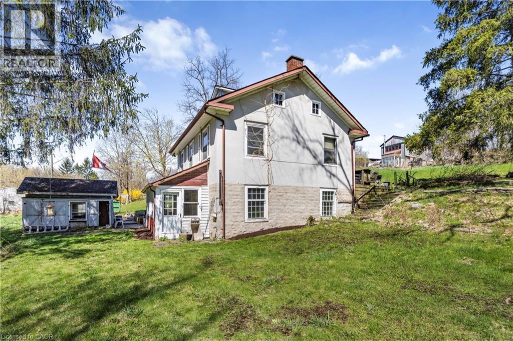 Back of house featuring a yard and a chimney - 36 Elgin E/S Street W, Conestogo, ON - Outdoor