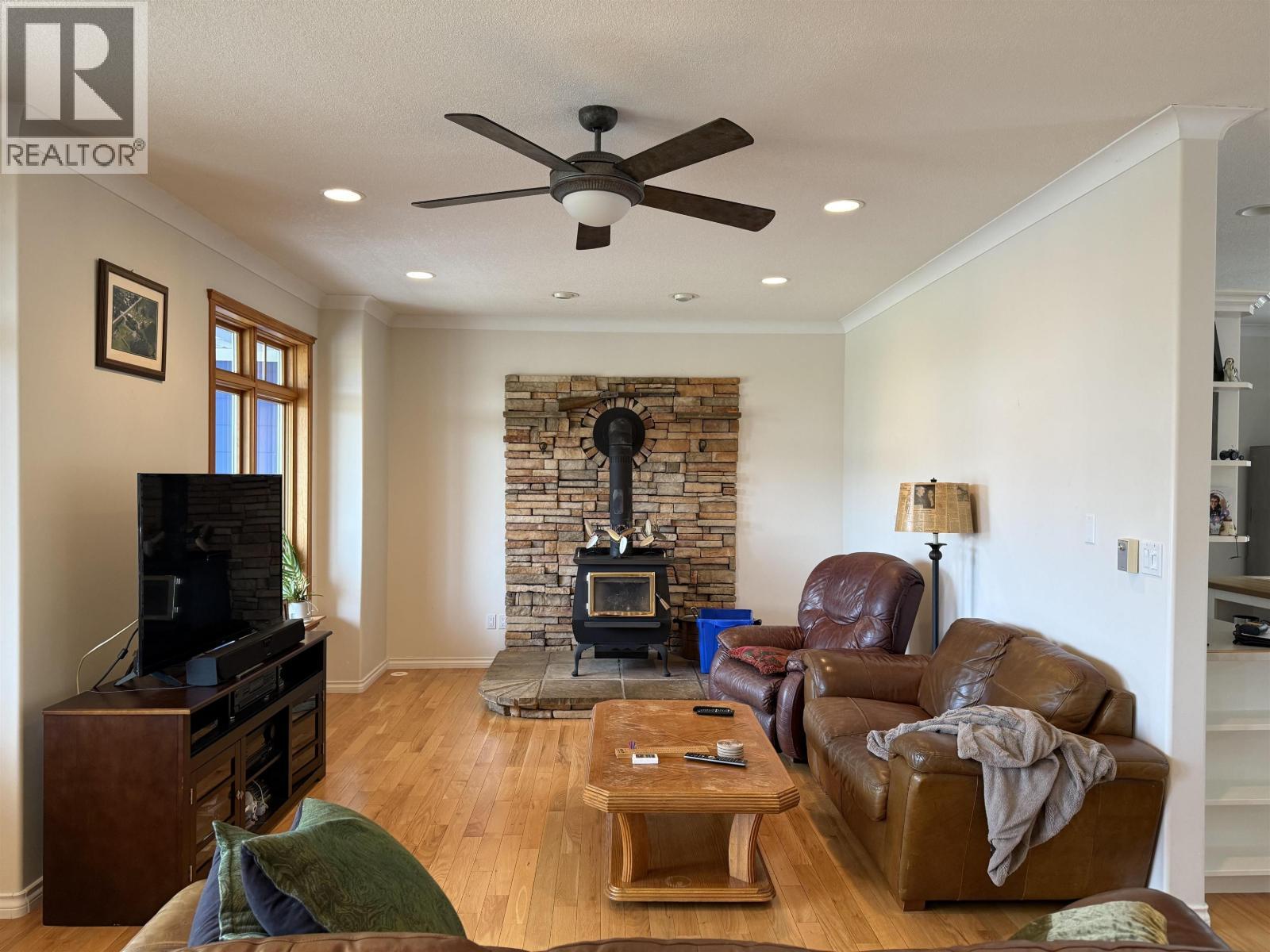 12762 Old Hope Road, Charlie Lake, BC - Indoor Photo Showing Living Room With Fireplace
