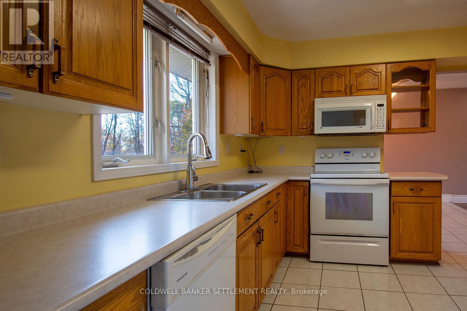 1925 Zealand Road, Frontenac (Frontenac Centre), ON - Indoor Photo Showing Kitchen With Double Sink