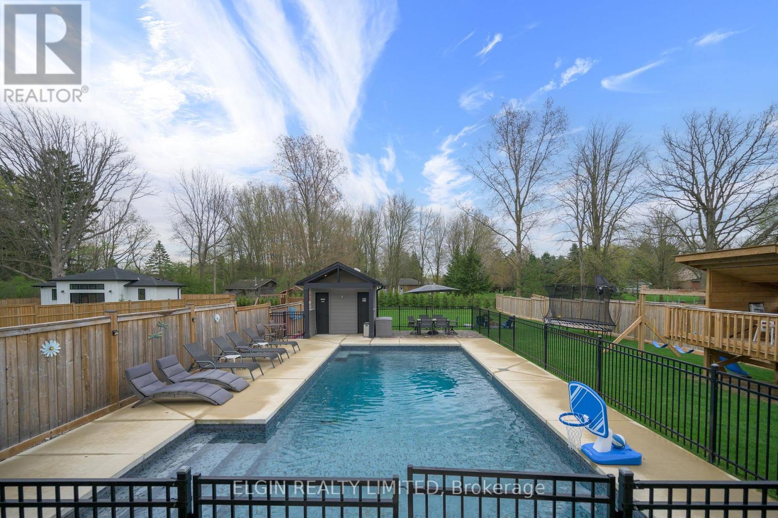 107 Optimist Drive, Southwold, ON - Outdoor With In Ground Pool With Backyard