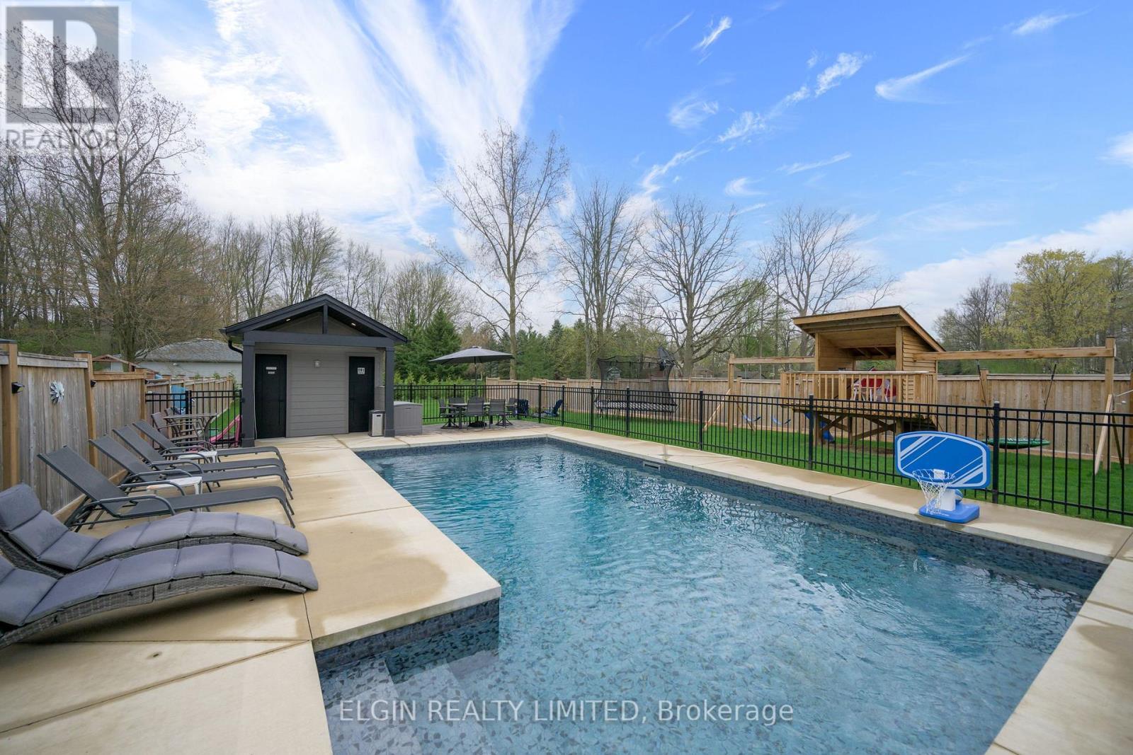 107 Optimist Drive, Southwold, ON - Outdoor With In Ground Pool