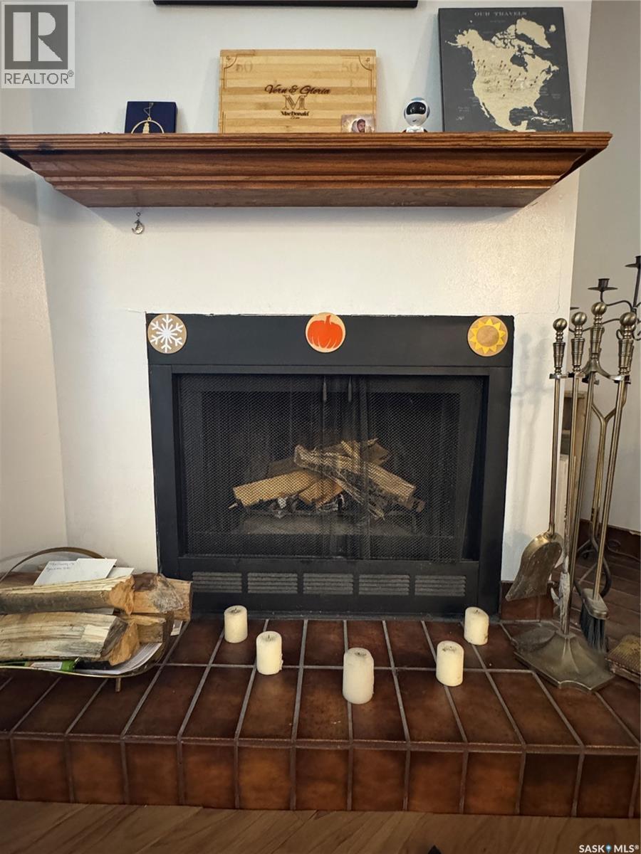 109 2911 Harding Street, Regina, SK - Indoor Photo Showing Living Room With Fireplace