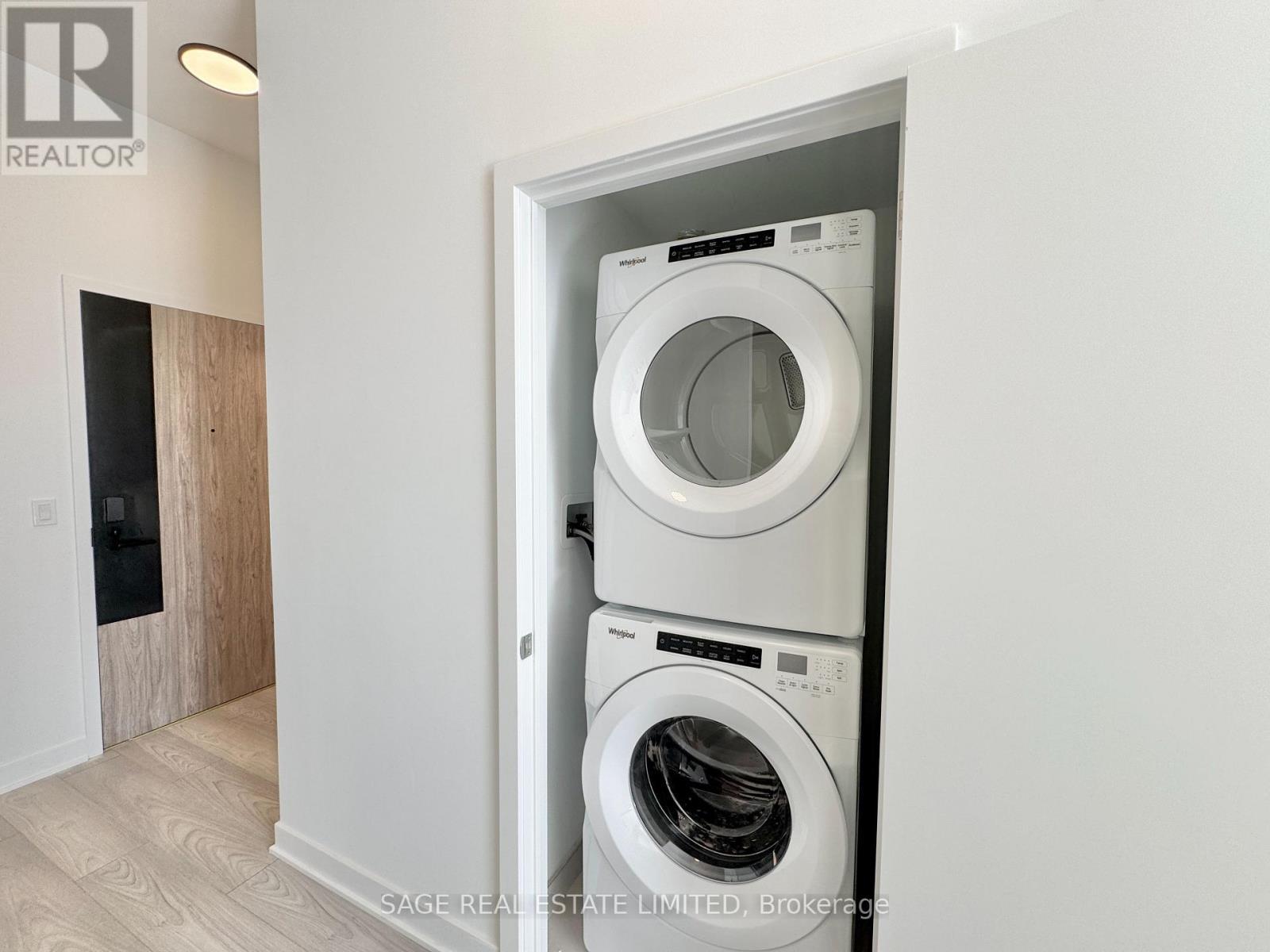 Full Sized Washer/Dryer - 202 - 1007 The Queensway, Toronto, ON - Indoor Photo Showing Laundry Room