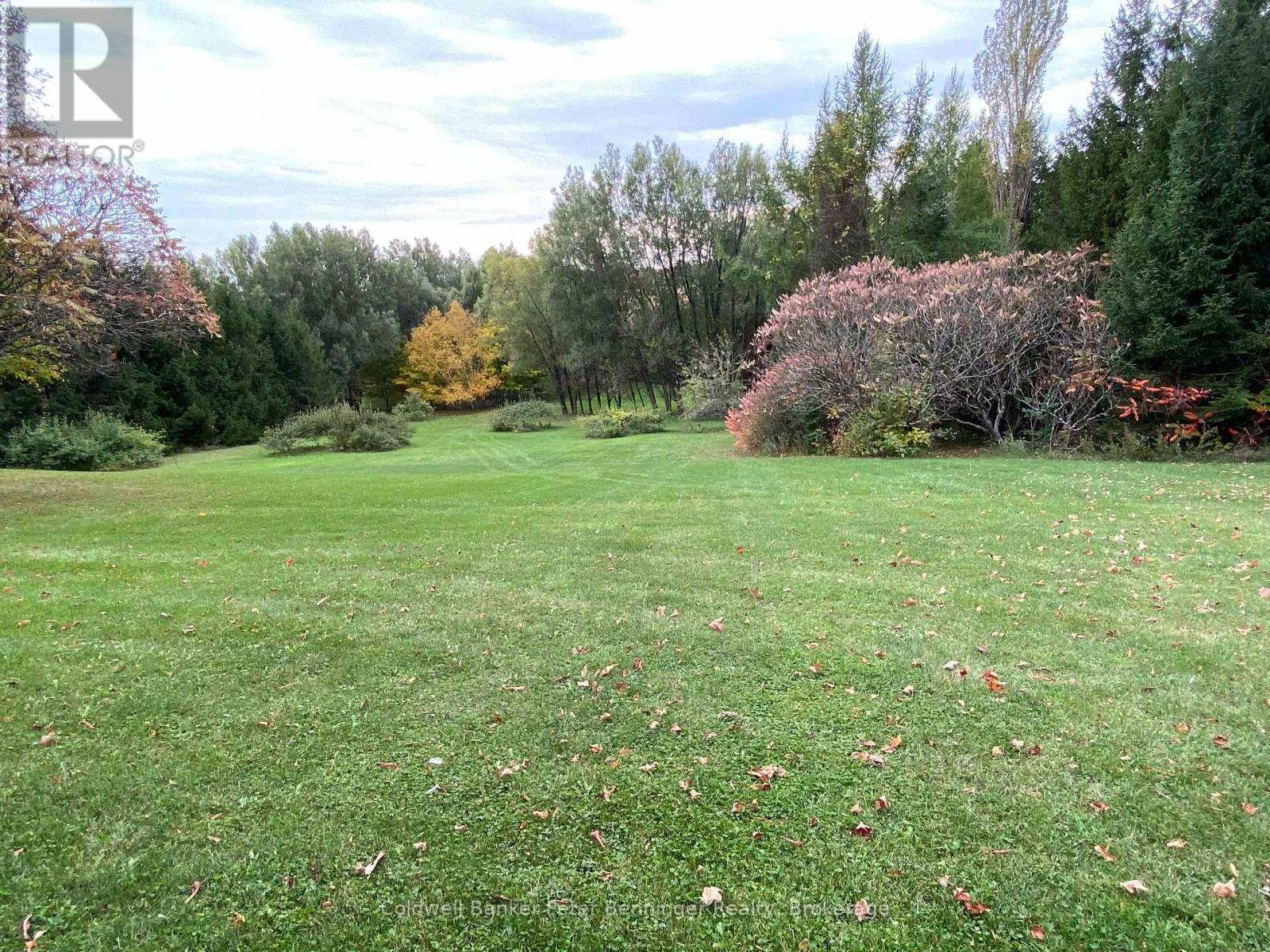 Mature trees and lawns around the home. - 1315 Concession 8 Concession, Kincardine, ON