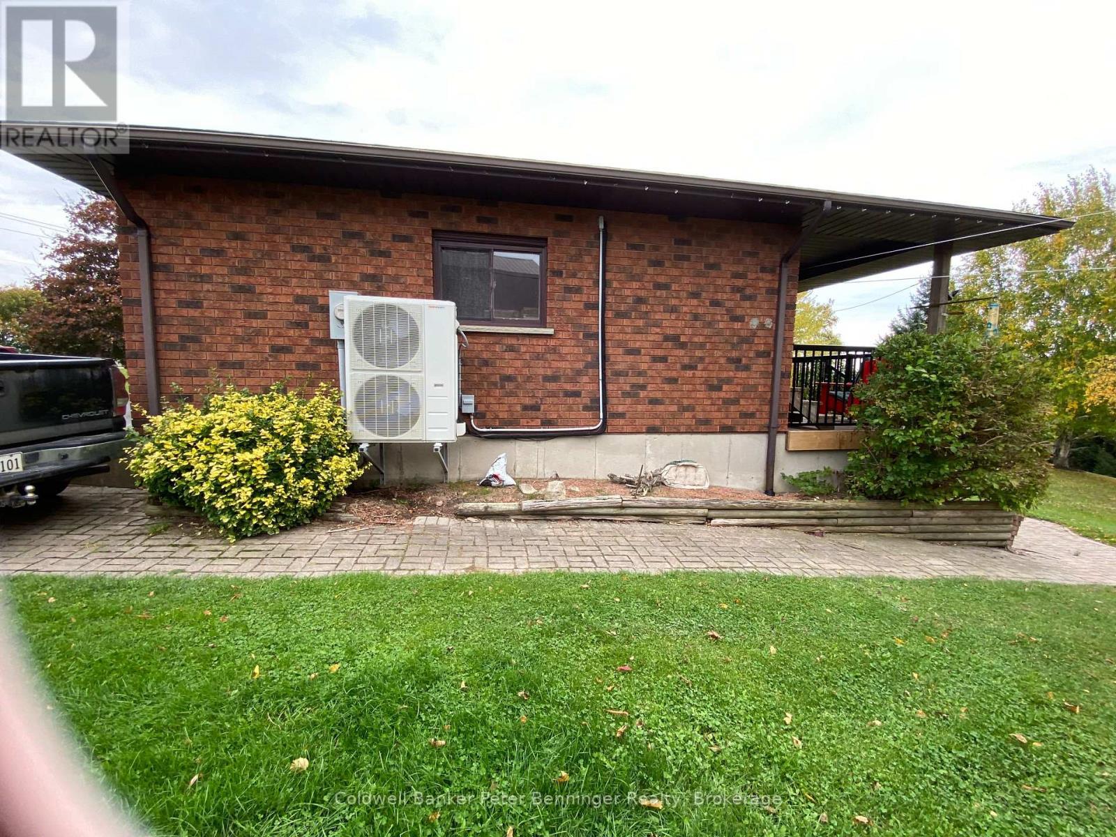West side of home, sidewalk from driveway to back. - 1315 Concession 8 Concession, Kincardine, ON