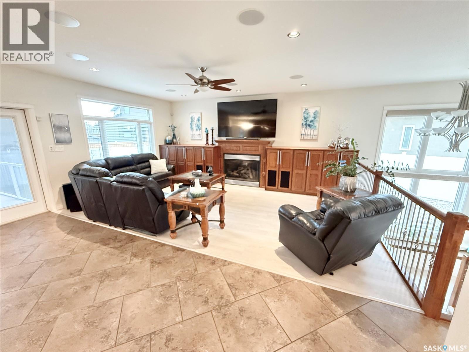1845 Gordon Miles Place, Weyburn, SK - Indoor Photo Showing Living Room With Fireplace