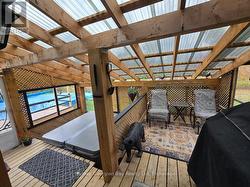 SITTING AREA, BBQ HUP & HOT TUB, DOOR TO POOL -