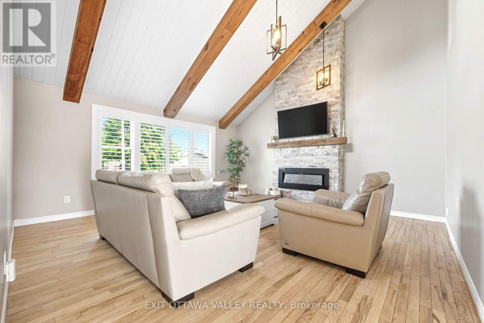 36 Thomas Street, Deep River, ON - Indoor Photo Showing Living Room With Fireplace