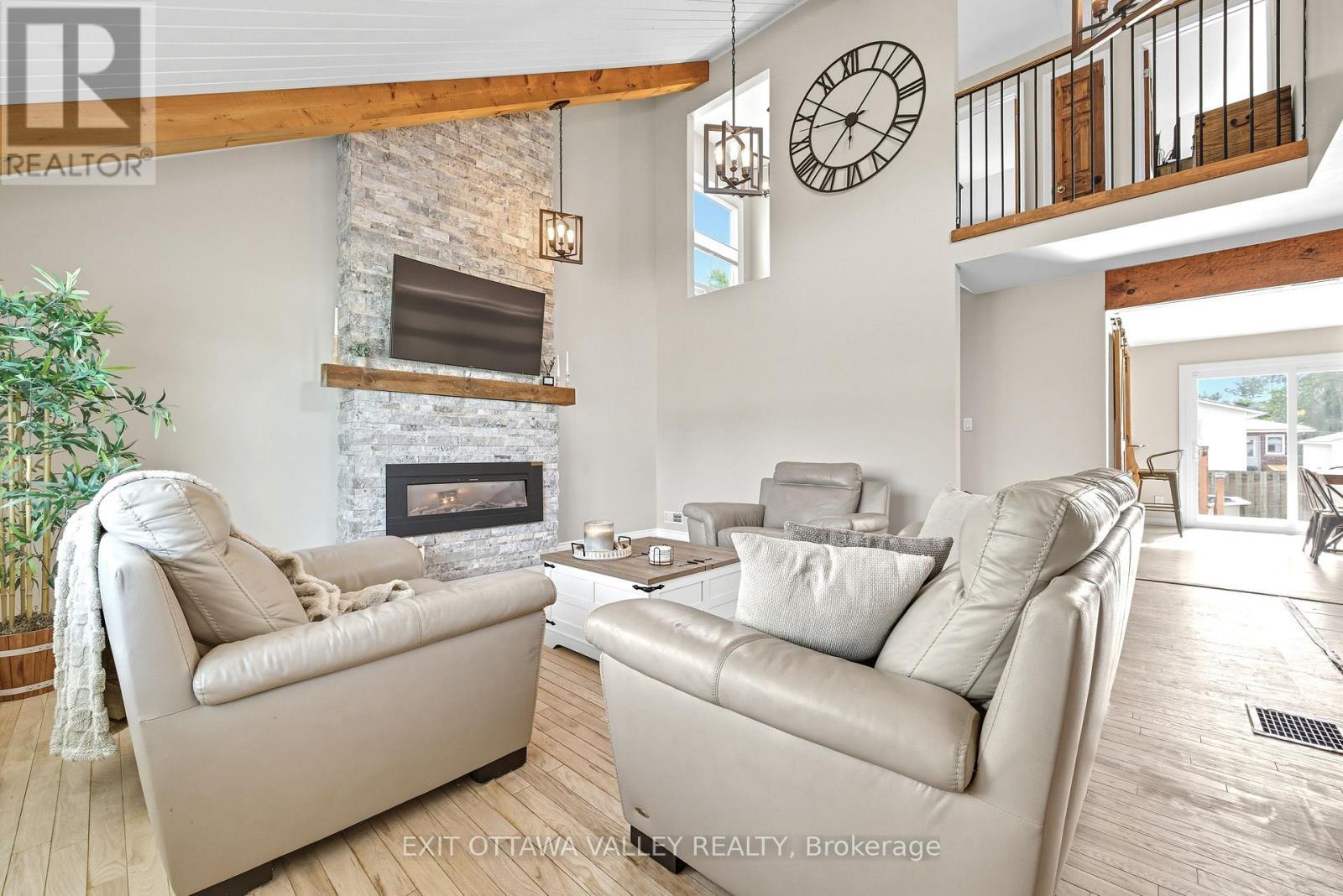 36 Thomas Street, Deep River, ON - Indoor Photo Showing Living Room With Fireplace